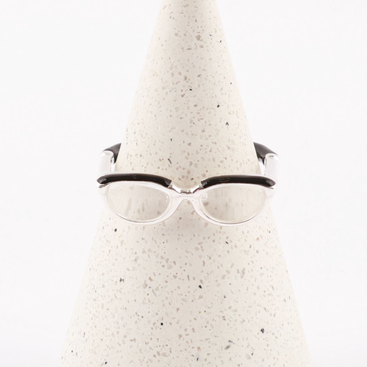  Front view of 925 silver glasses ring on ring holder displaying symmetrical frame design with clear lenses 