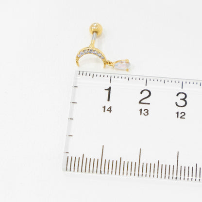 Size reference of crescent moon piercing next to ruler showing approximately 13mm total length