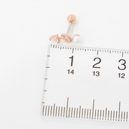 Size reference photo: rose gold arrow pearl drop helix stud next to measuring ruler showing 8mm total length