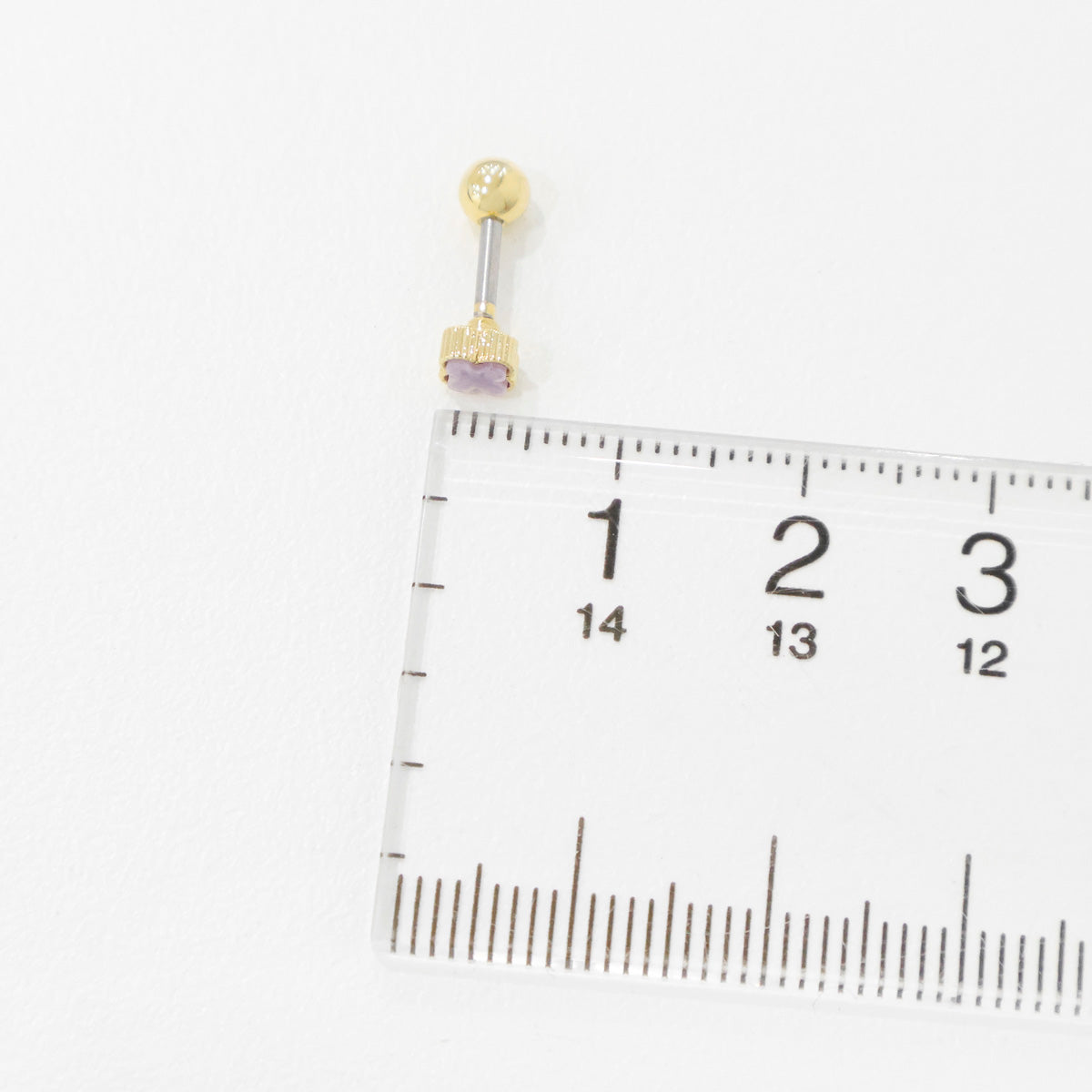 Four leaf clover mother of pearl piercing size comparison with ruler showing 4mm dimensions titanium post