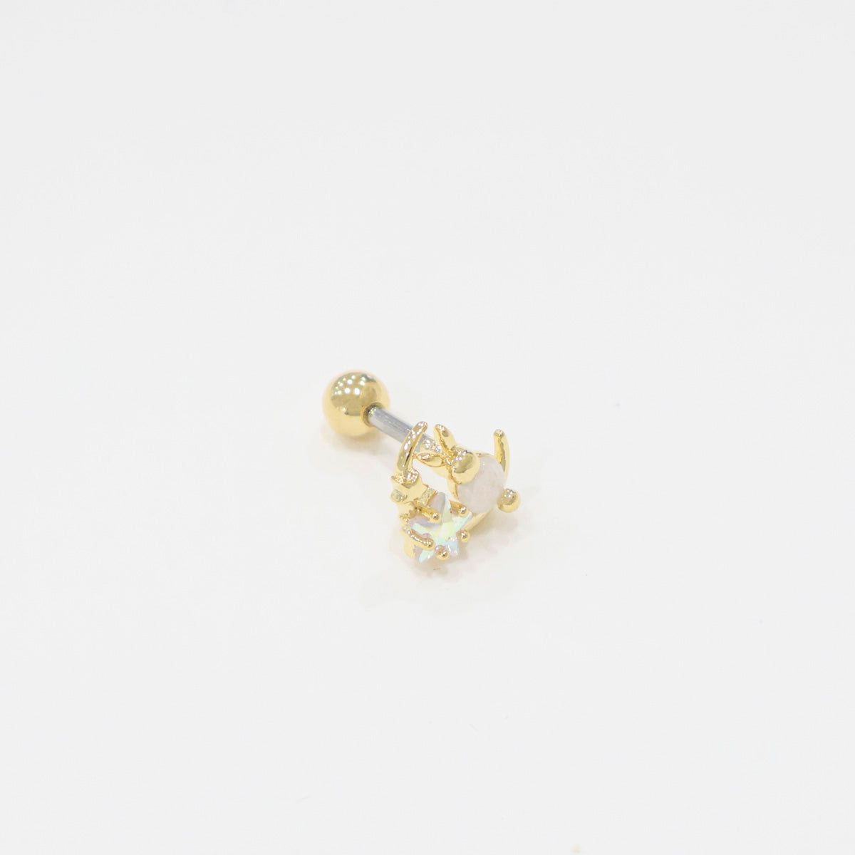 One gold bunny moon barbell earring photographed from a slight top-down angle, emphasizing the crystal details and metallic finish on a white background.