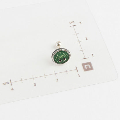 Size measurement of green Oreo piercing with 925 silver post and ruler on white background