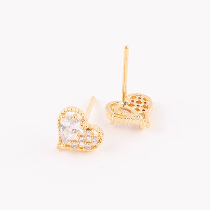 Gold heart-shaped earrings with detailed back setting shown flat on a white surface, showcasing front and back view.