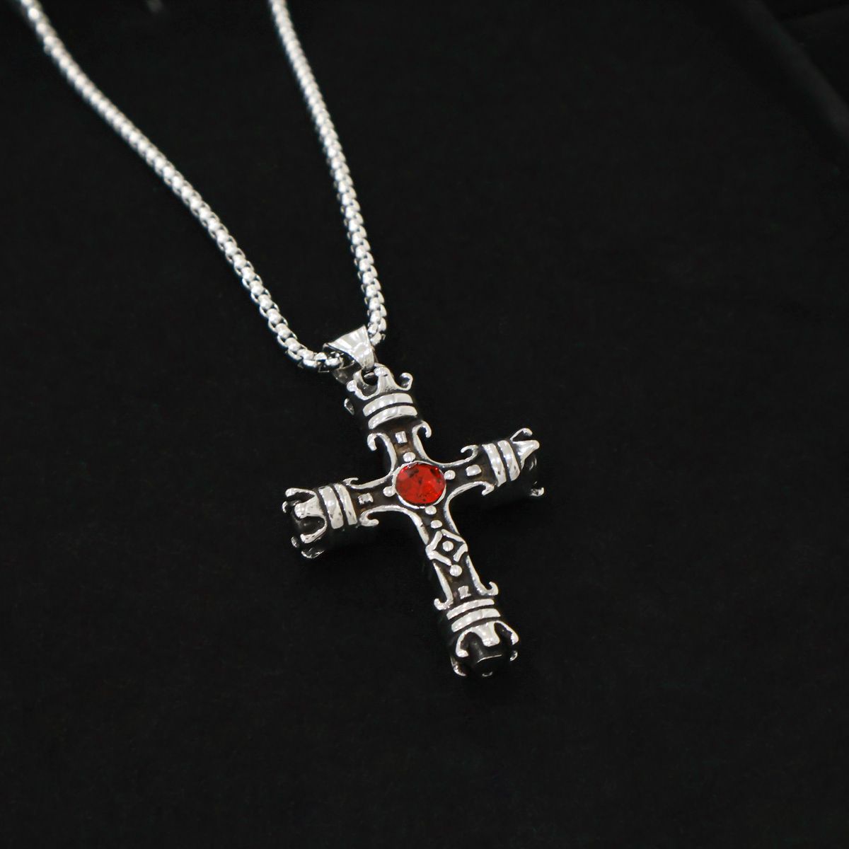 Vintage gothic cross pendant with red crystal detail"
