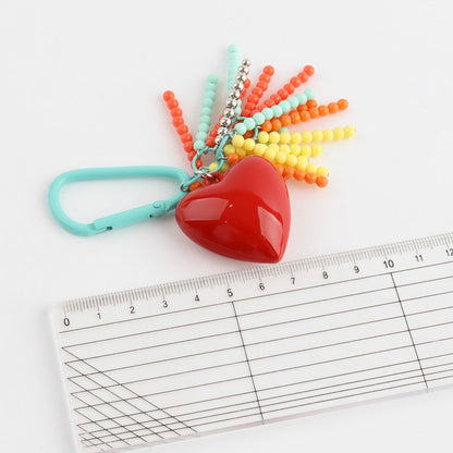 Heart keychain size measurement - Handmade beaded bag charm with colorful tassels detail shot