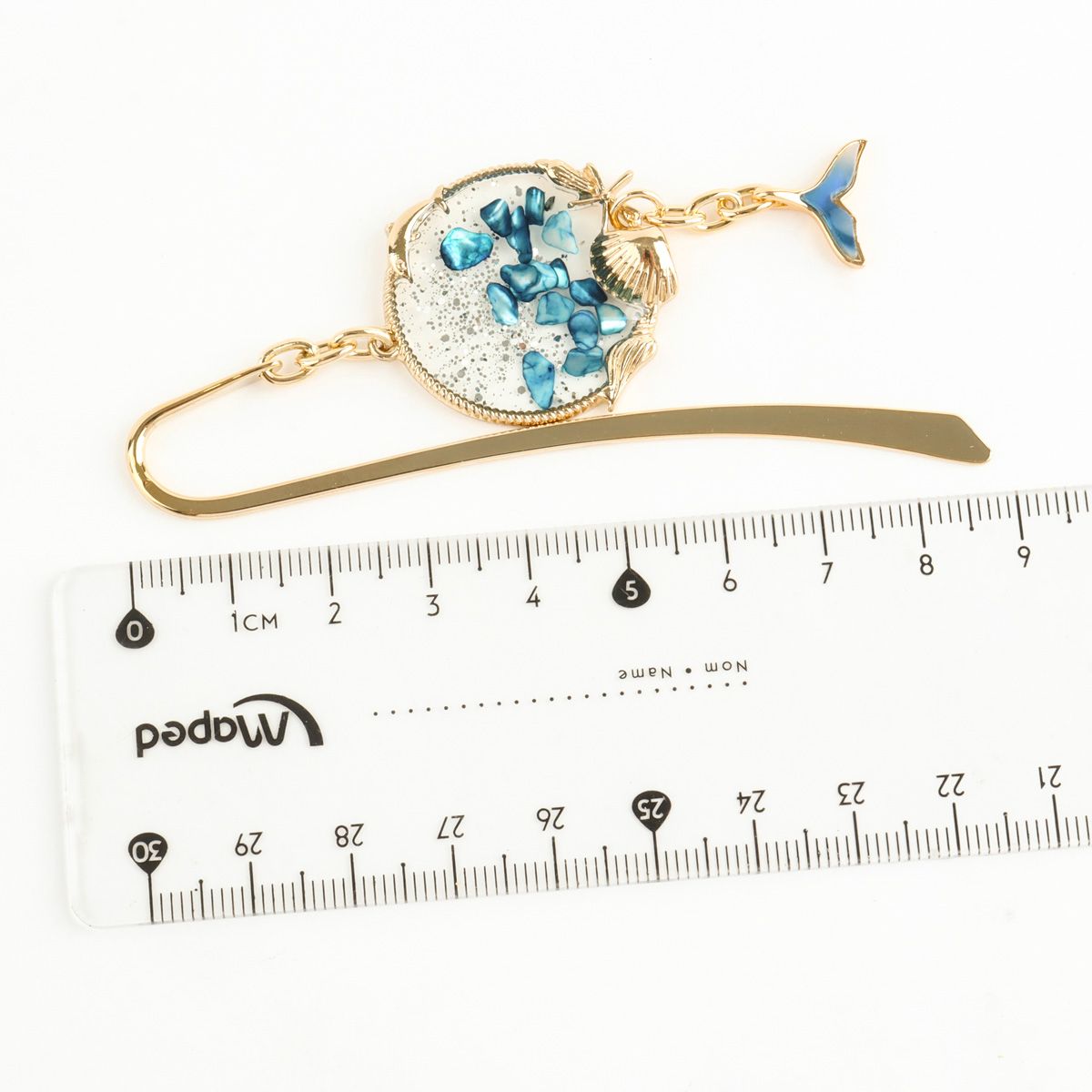 Whale tail metal bookmark with ruler showing 9cm total length measurement