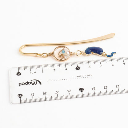 Cat wave bookmark size measurement showing 9cm length with ruler, metal page marker dimensions for standard books