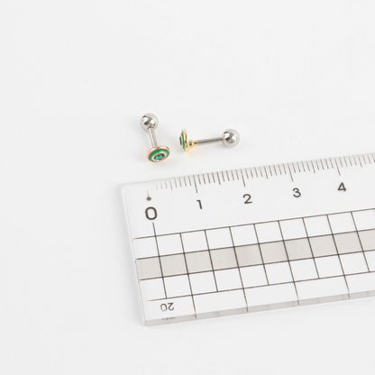 Size comparison of green epoxy barbell earring next to a ruler