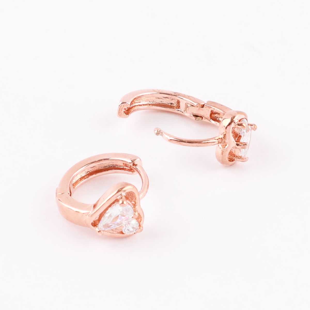 Rose gold huggie hoop earrings in open and closed positions, highlighting heart stone and hinge mechanism.