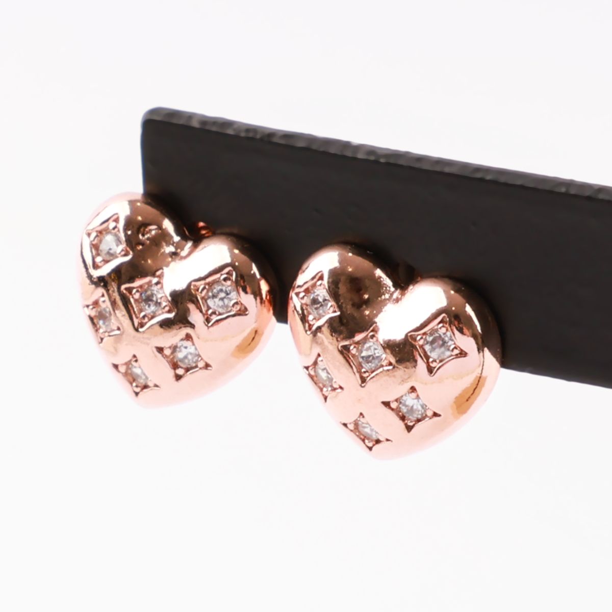 Rose gold puffy heart earrings with luxury quilted design and crystal embellishments