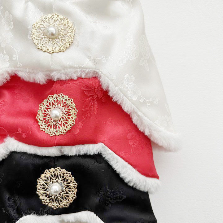 orean traditional jobawi winter hats in white, red, and black with pearl filigree brooch and fur trim, Santa-style