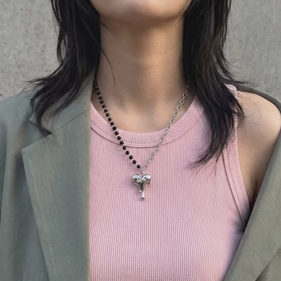 Korean street style melting heart necklace asymmetric bead chain pendant, oversized khaki blazer pink tank off-duty look