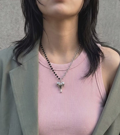 Korean street style melting heart necklace asymmetric bead chain pendant, oversized khaki blazer pink tank off-duty look