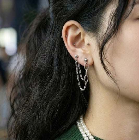 Connect two adjacent lobe piercings for a sleek, minimalist vibe perfect for everyday wear.