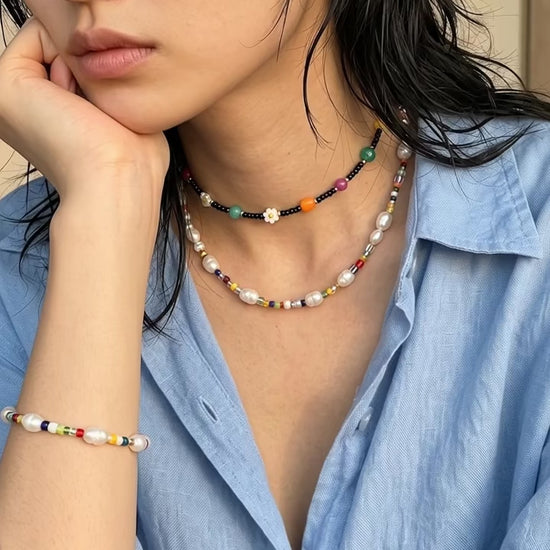 Coquette-coded necklace layering — 8ttitto8 pearl bead necklace with black seed bead choker, linen shirt vacation styling inspo