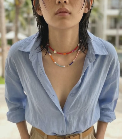  K-style layered beaded necklace two-strand stacking look linen shirt cargo pants vacation outfit jewelry inspo.