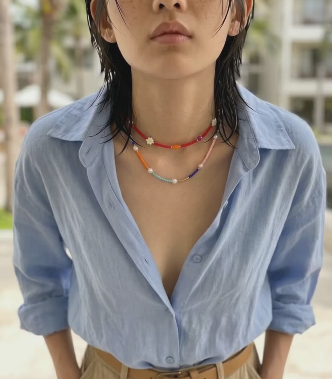  K-style layered beaded necklace two-strand stacking look linen shirt cargo pants vacation outfit jewelry inspo.