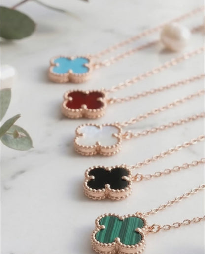 Rose gold clover gemstone necklace 5 color lineup 925 silver bezel-set pendant hypoallergenic K-style jewelry flat lay.