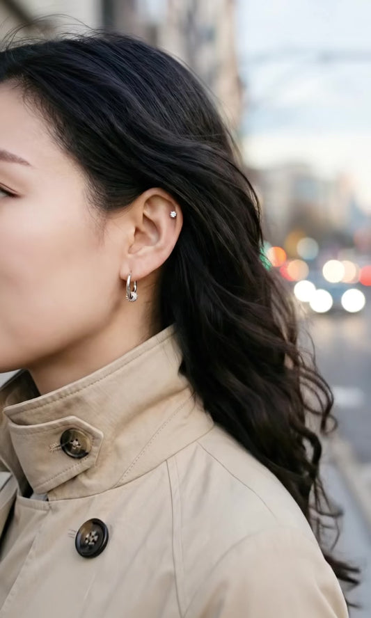 Silver cubic zirconia huggie hoop earrings street style close-up